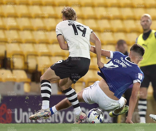 070825 - Port Vale v Cardiff City - Sky Bet League 1 - Ben Waine of Port Vale brings down Rubin Colwill of Cardiff near the end of the match