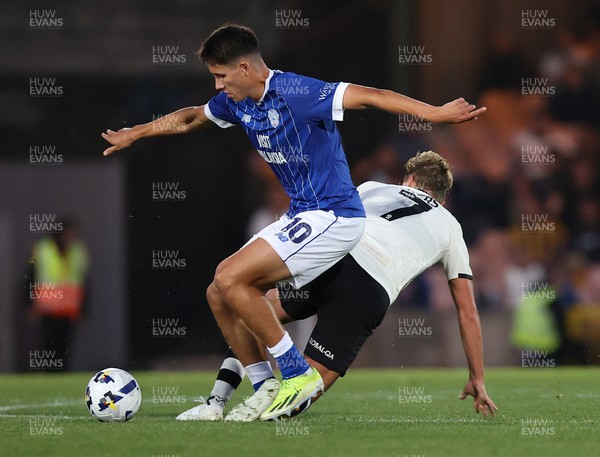070825 - Port Vale v Cardiff City - Sky Bet League 1 - Rubin Colwill of Cardiff takes the ball from George Byers of Port Vale of Port Vale