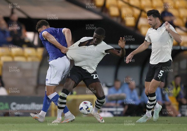 070825 - Port Vale v Cardiff City - Sky Bet League 1 - Yousef Saleh of Cardiff holds back Jesse Debrah of Port Vale