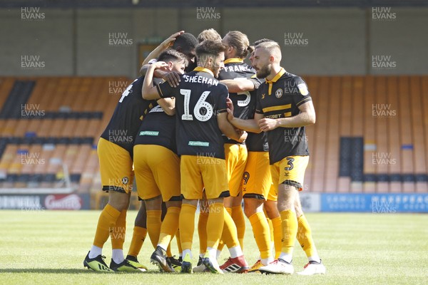 010918 - Port Vale v Newport County, Sky Bet League 2 - Scot Bennett of Newport County (hidden) celebrates scoring his side's first goal with team mates