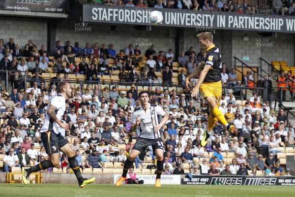 010918 - Port Vale v Newport County, Sky Bet League 2 - Mickey Demetriou of Newport County (right) heads at goal 