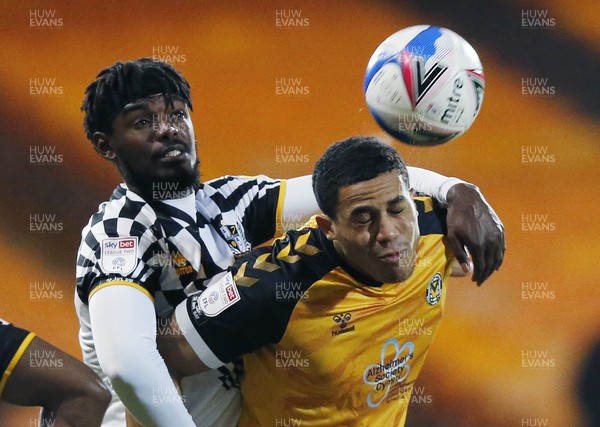 160321 - Port Vale v Newport County - Sky Bet League 2 - Priestley Farquharson of Newport County and Theo Robinson of Port Vale go for the header