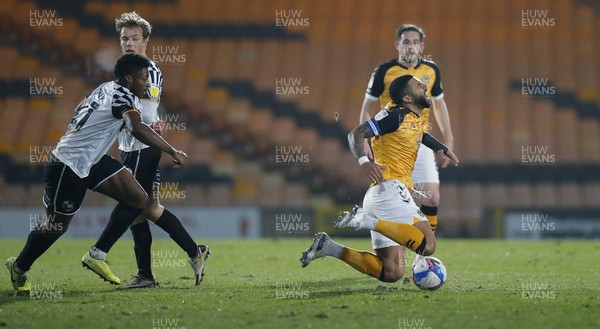 160321 - Port Vale v Newport County - Sky Bet League 2 - Joss Labadie of Newport County is caught by a tackle from Cristian Montano of Port Vale