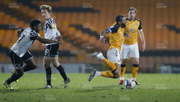 160321 - Port Vale v Newport County - Sky Bet League 2 - Joss Labadie of Newport County is caught by a tackle from Cristian Montano of Port Vale