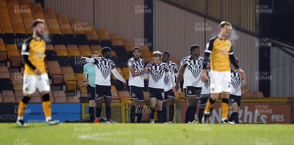 160321 - Port Vale v Newport County - Sky Bet League 2 - Port Vale players celebrate with Newport looking dejected