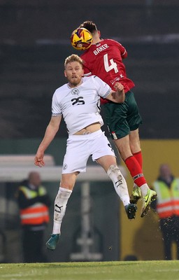 180125 - Port Vale v Newport County - Sky Bet League 2 - Matt Baker of Newport heads away from Jayden Stockley of Port Vale