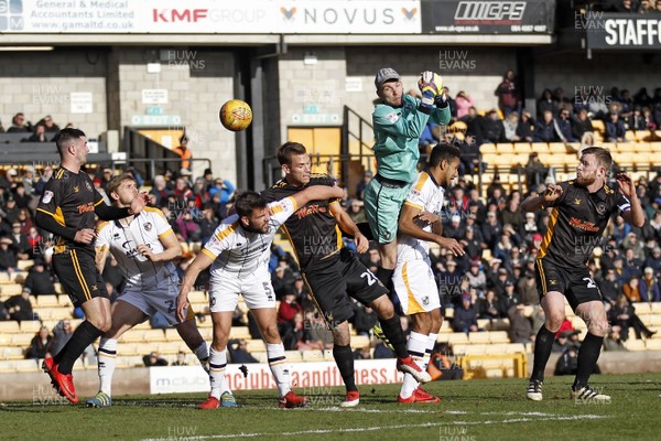 240218 - Port Vale v Newport County, Sky Bet League 2 - Ryan Boot of Port Vale (centre) misses a cross as Newport County attack close in