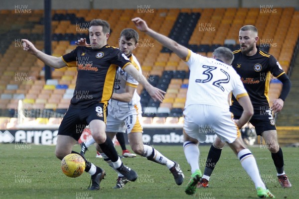 240218 - Port Vale v Newport County, Sky Bet League 2 - Matthew Dolan of Newport County (left) protects the ball from the Port Vale defence