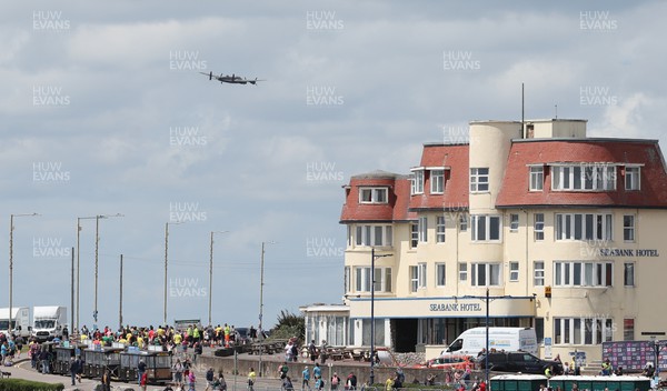 030722 - Run 4 Wales Healthspan Porthcawl 10k - A World War II Lancaster flies over Porthcawl as families take part in the Fun Run, the final event of the day