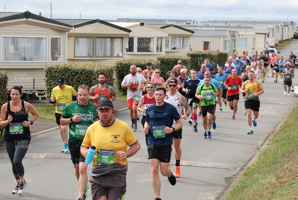 030722 - Run 4 Wales Healthspan Porthcawl 10k - Runners make their way around the course in the Porthcawl 10k