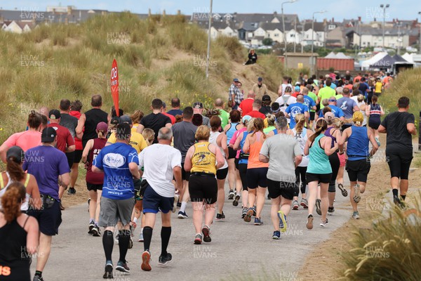 030722 - Run 4 Wales Healthspan Porthcawl 10k - Runners make their way around the course in the Porthcawl 10k