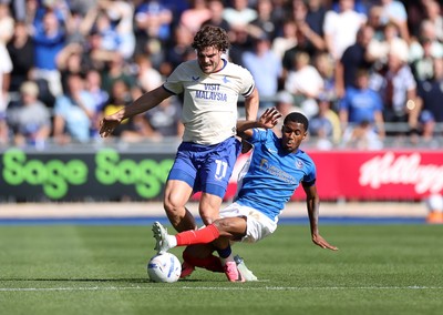 050926 - Portsmouth FC v Cardiff City - SkyBet Championship - Ollie Tanner of Cardiff City is tackled by Luke Le Roux of Portsmouth 