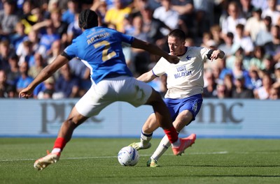 050926 - Portsmouth FC v Cardiff City - SkyBet Championship - Jack Moylan of Cardiff City is challenged by Benjamin Arthur of Portsmouth 