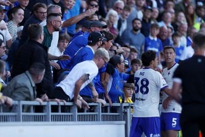 050926 - Portsmouth FC v Cardiff City - SkyBet Championship - Perry Ng pulls Krystian Bielik of Cardiff City away from the crowd