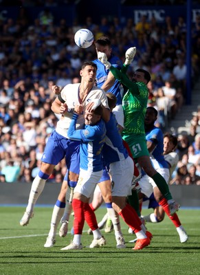 050926 - Portsmouth FC v Cardiff City - SkyBet Championship - Yousef Salech of Cardiff City and keeper Daniel Bielica of Portsmouth go for the ball