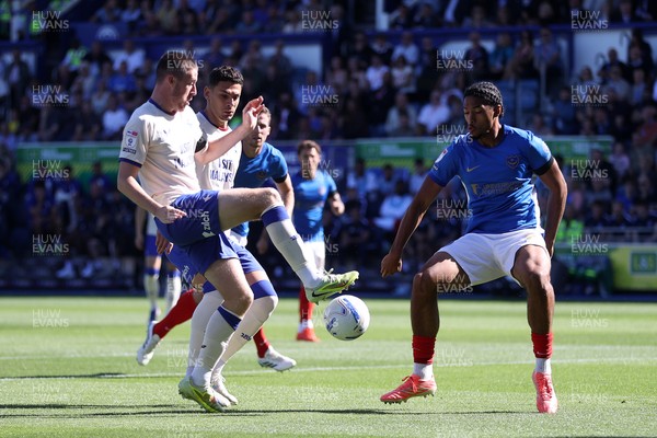 050926 - Portsmouth FC v Cardiff City - SkyBet Championship - Jack Moylan of Cardiff City is challenged by Benjamin Arthur of Portsmouth 