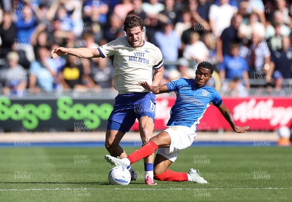 050926 - Portsmouth FC v Cardiff City - SkyBet Championship - Ollie Tanner of Cardiff City is tackled by Luke Le Roux of Portsmouth 