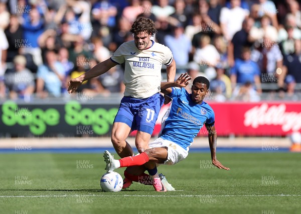 050926 - Portsmouth FC v Cardiff City - SkyBet Championship - Ollie Tanner of Cardiff City is tackled by Luke Le Roux of Portsmouth 