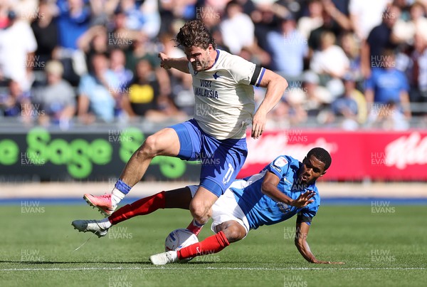 050926 - Portsmouth FC v Cardiff City - SkyBet Championship - Ollie Tanner of Cardiff City is tackled by Luke Le Roux of Portsmouth 