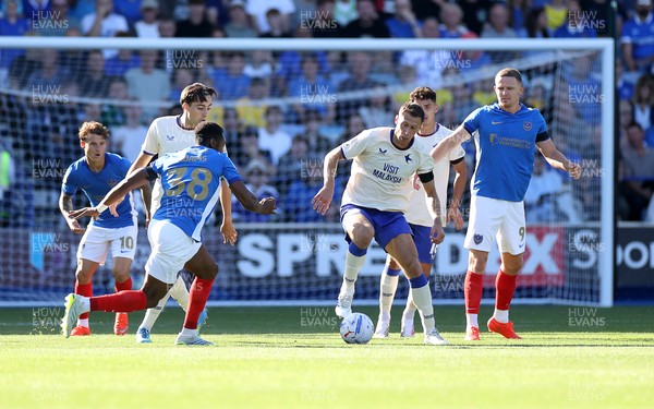 050926 - Portsmouth FC v Cardiff City - SkyBet Championship - Krystian Bielik of Cardiff City is challenged by Ebou Adams of Portsmouth 