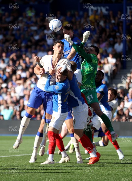 050926 - Portsmouth FC v Cardiff City - SkyBet Championship - Yousef Salech of Cardiff City and keeper Daniel Bielica of Portsmouth go for the ball