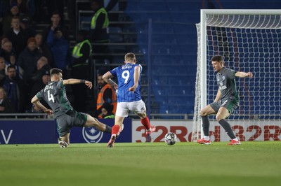 110225  Portsmouth v Cardiff City, EFL Sky Bet Championship - Colby Bishop of Portsmouth beats Cardiff City goalkeeper Jak Alnwick to score goal