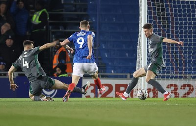 110225  Portsmouth v Cardiff City, EFL Sky Bet Championship - Colby Bishop of Portsmouth beats Cardiff City goalkeeper Jak Alnwick to score goal