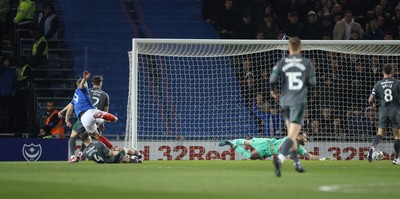 110225  Portsmouth v Cardiff City, EFL Sky Bet Championship - Colby Bishop of Portsmouth beats Cardiff City goalkeeper Jak Alnwick to score goal