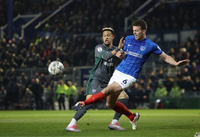 110225  Portsmouth v Cardiff City, EFL Sky Bet Championship - Callum Robinson of Cardiff City is challenged by Conor Shaughnessy of Portsmouth