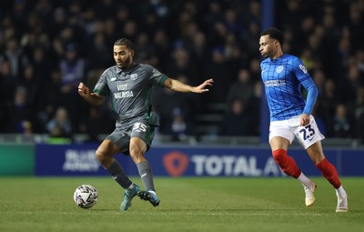 110225  Portsmouth v Cardiff City, EFL Sky Bet Championship - Andy Rinomhota of Cardiff City holds off Josh Murphy of Portsmouth