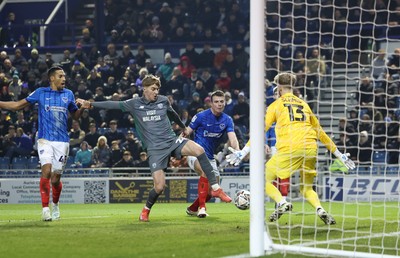 110225  Portsmouth v Cardiff City, EFL Sky Bet Championship - Portsmouth goalkeeper Nicolas Schmid  saves from Joel Bagan of Cardiff City