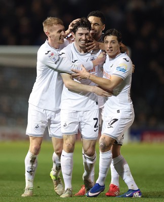 100326 - Portsmouth v Swansea City, EFL Sky Bet Championship - Josh Key of Swansea City is congratulated by team mates after scoring the second goal