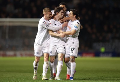 100326 - Portsmouth v Swansea City, EFL Sky Bet Championship - Josh Key of Swansea City is congratulated by team mates after scoring the second goal