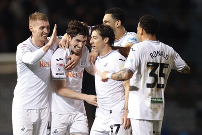 100326 - Portsmouth v Swansea City, EFL Sky Bet Championship - Josh Key of Swansea City is congratulated by team mates after scoring the second goal