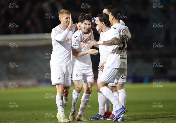 100326 - Portsmouth v Swansea City, EFL Sky Bet Championship - Josh Key of Swansea City is congratulated by team mates after scoring the second goal