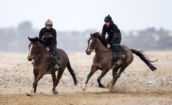 040220 - Picture shows Potters Corners (right) during morning gallops at trainers Christian Williams' stables in Ogmore on Sea, South Wales