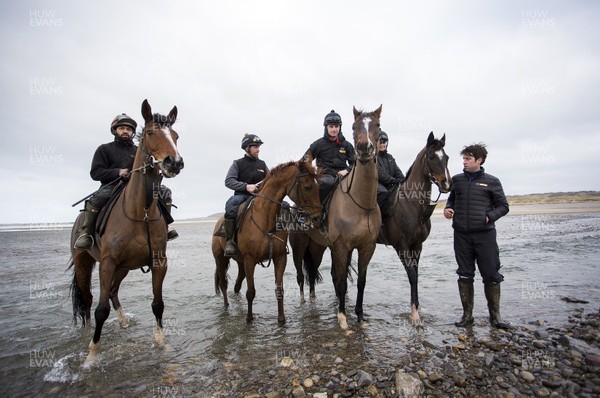 040220 - Picture shows trainer Christian Williams with Potters Corner (second in from right) during their morning gallops on the beach in Ogmore on Sea, South Wales