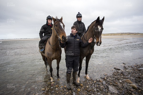 040220 - Picture shows trainer Christian Williams with Potters Corner (left) during their morning gallops on the beach in Ogmore on Sea, South Wales