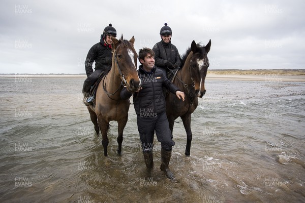 040220 - Picture shows trainer Christian Williams with Potters Corner (left) during their morning gallops on the beach in Ogmore on Sea, South Wales