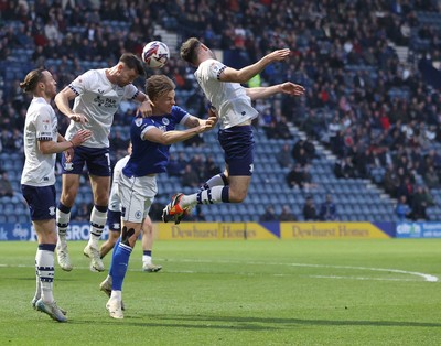 080425 - Preston North End v Cardiff City - Sky Bet Championship - Rubin Colwill of Cardiff is sandwiched by Will Keane of Preston North End and Ryan Porteous of Preston North End