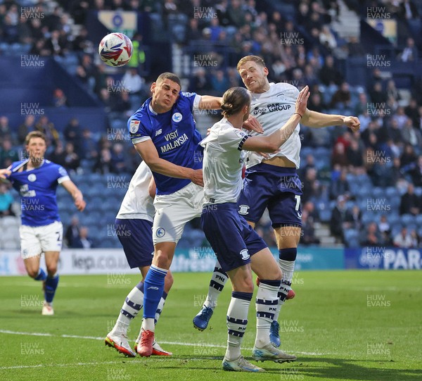 080425 - Preston North End v Cardiff City - Sky Bet Championship - Yousef Saleh of Cardiff is sandwiched between Lewis Gibson of Preston North End and Will Keane of Preston North End as he tries to receive the corner ball