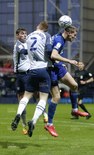 201121 - Preston North End v Cardiff City - Sky Bet Championship - Mark McGuiness of Cardiff goes up with Sepp van den Berg of Preston North End