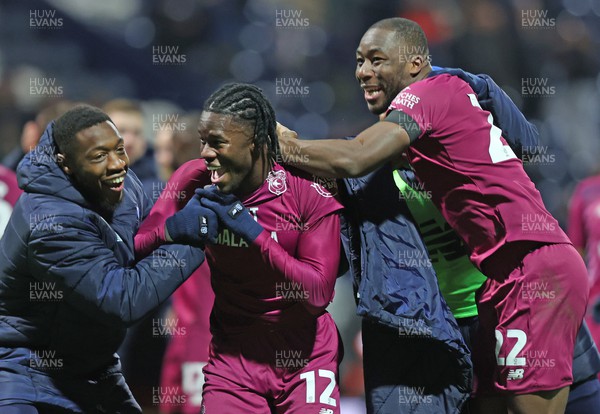 251123 - Preston North End v Cardiff City - Sky Bet Championship - Winning goal scorer Ike Ugbo of Cardiff is mobbed by  Mahlon Romeo of Cardiff and Yakou Meite of Cardiff