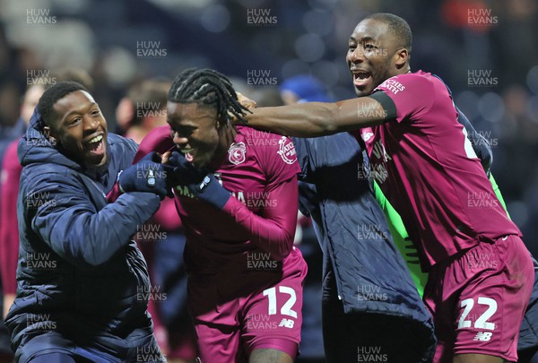 251123 - Preston North End v Cardiff City - Sky Bet Championship - Winning goal scorer Ike Ugbo of Cardiff is mobbed by  Mahlon Romeo of Cardiff and Yakou Meite of Cardiff