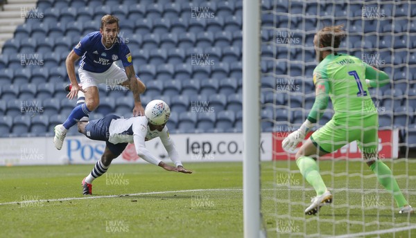 270620 - Preston North End v Cardiff City - Sky Bet Championship - Joe Ralls of Cardiff heads the ball past Declan Rudd of Preston North End and over Darnell Fisher of Preston North End for the 1st goal of the match