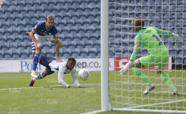 270620 - Preston North End v Cardiff City - Sky Bet Championship - Joe Ralls of Cardiff heads the ball past Declan Rudd of Preston North End and over Darnell Fisher of Preston North End for the 1st goal of the match