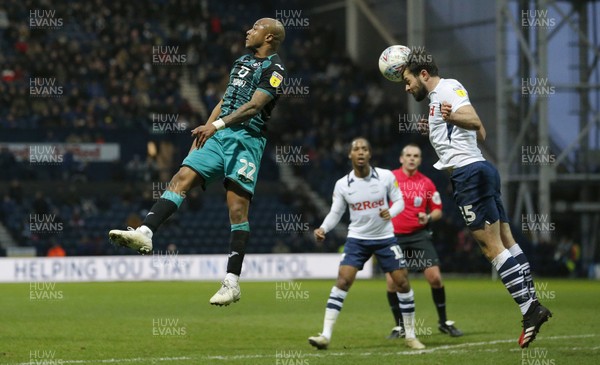 010220 - Preston North End v Swansea City - Sky Bet Championship - Joe Rafferty of Preston North End clears from Andre Ayew of Swansea   