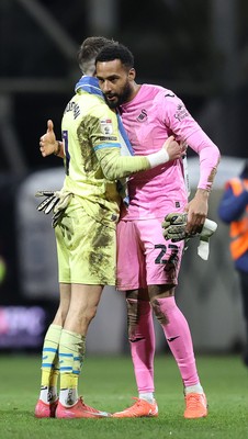 040325 - Preston North End v Swansea City - Sky Bet Championship - Lawrence Vigouroux of Swansea hugs Goalkeeper Freddie Woodman of Preston North End at the end of the match