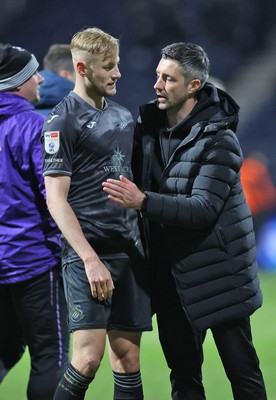 040325 - Preston North End v Swansea City - Sky Bet Championship - Swansea manager Alan Sheehan gives Harry Darling of Swansea a hug at the end of the match