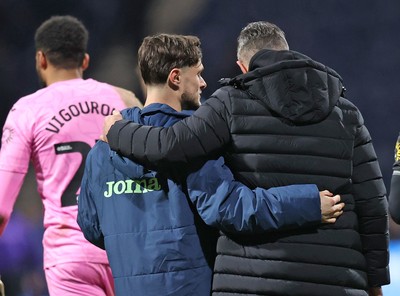 040325 - Preston North End v Swansea City - Sky Bet Championship - Liam Cullen of Swansea is hugged by Swansea manager Alan Sheehan as they leave the pitch at the end of the match